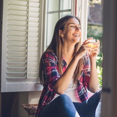 Energy Shield Window and Door Company - Best Windows, Doors, Shutters in San Tan, Arizona Smiling in front of a Window - The Best Windows, Doors, Shutters in San Tan, Arizona