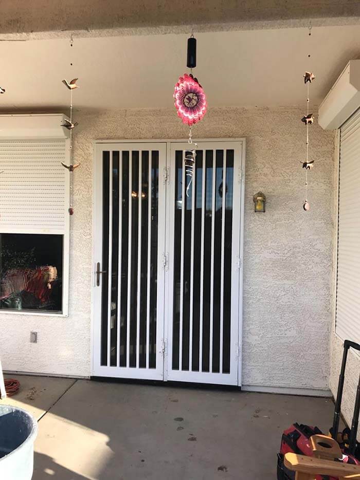 A replacement patio door adorned with a hanging flower.