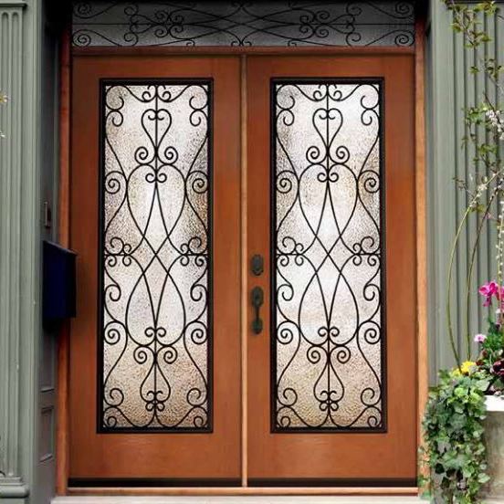 A front door with wrought iron and glass offered by a replacement doors company.