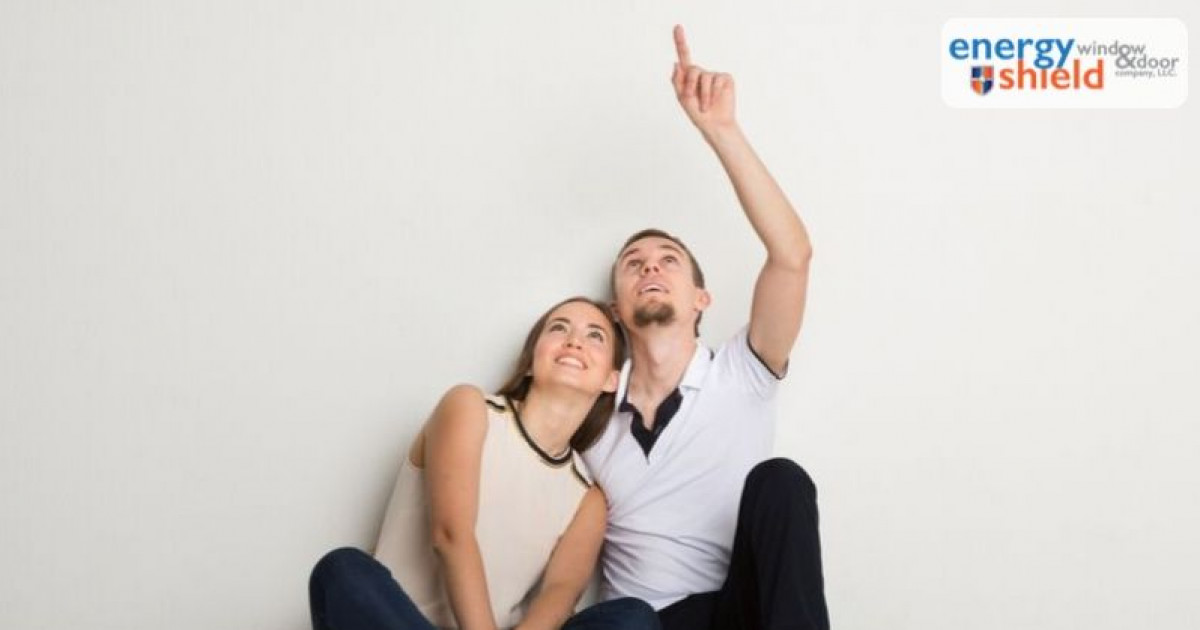 Couple admiring the ceiling - How to Make Your Ceiling Look Higher in 8 Easy Steps