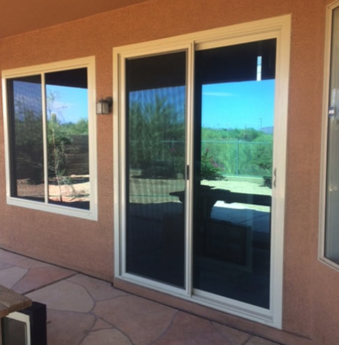 A sliding glass replacement door for patios provided by a window replacement company.