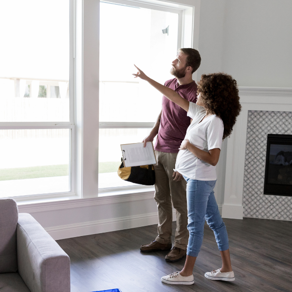 Homeowner comparing window installation options.